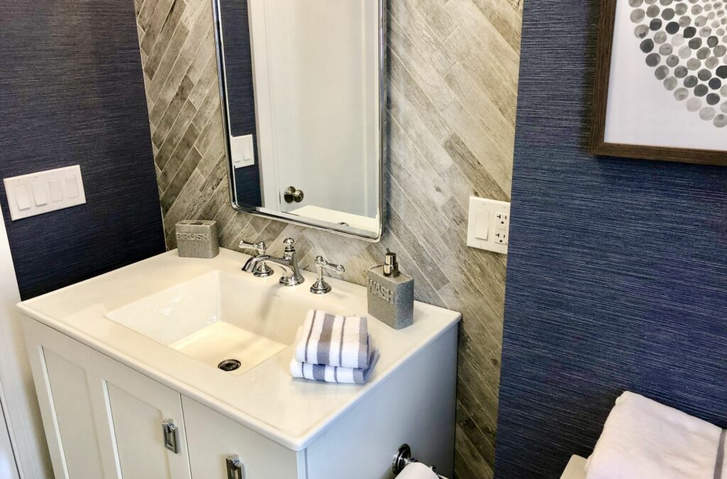 Bathroom Remodeling with Herringbone Tile, Custom Mirror, One Piece Vanity Sinktop, Grasscloth Wallpaper, Kohler Fixtures in Union, Union County NJ