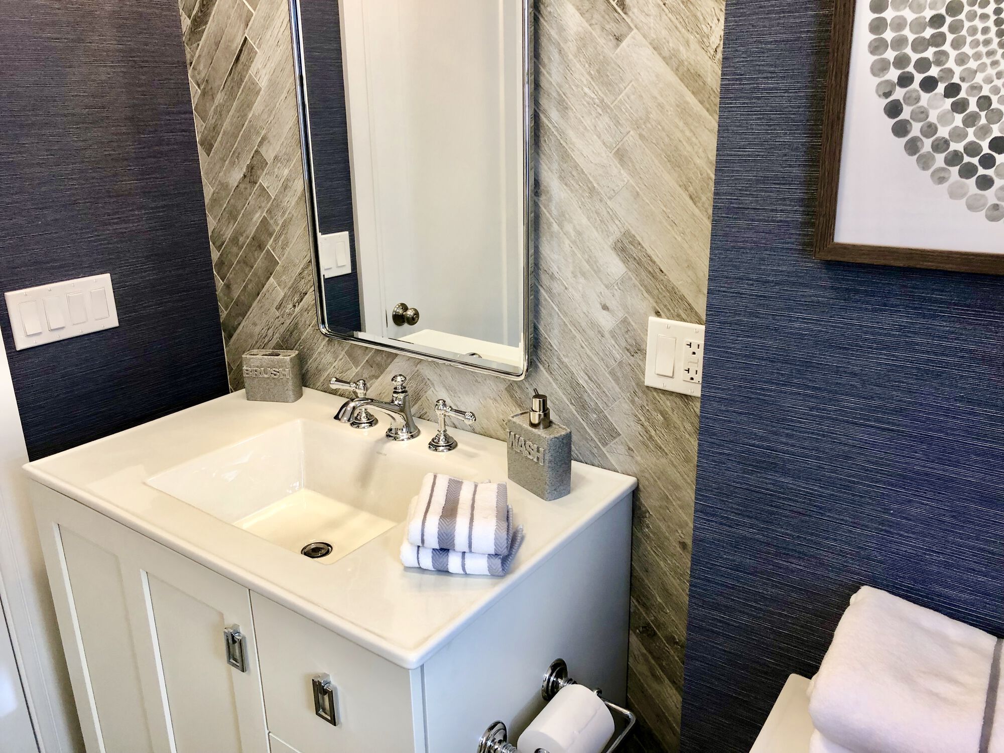 Bathroom Remodeling with Herringbone Tile, Custom Mirror, One Piece Vanity Sinktop, Grasscloth Wallpaper, Kohler Fixtures in Union, Union County NJ