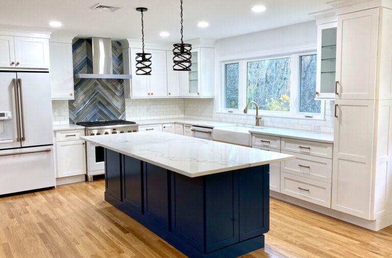 Island in Custom Blue Color, New Window facing Yard with Sink Under, GE Cafe Appliances Matte White Finish, Oak Flooring in Berkeley Heights, Union County NJ