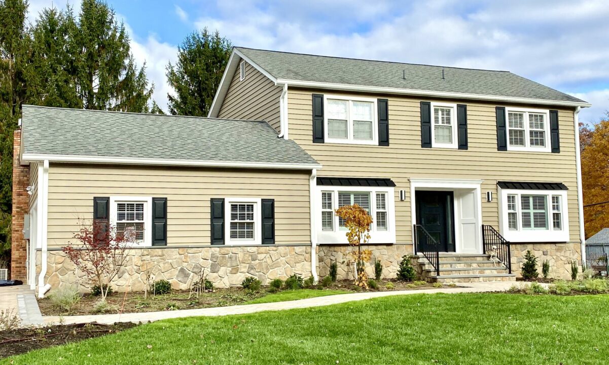 Prodigy Siding Tuscan Clay, Boral Dressed Fieldstone, Black Metal Roofing, Azek Trim, Therma Tru Front Door, Cambridge Pavers Walkway and Driveway in Randolph, Morris County NJ