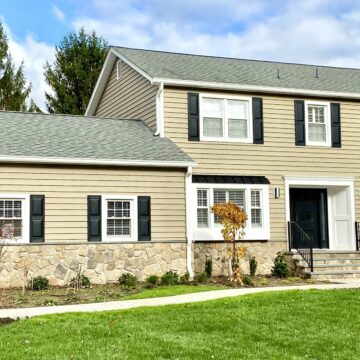 Prodigy Siding Tuscan Clay, Boral Dressed Fieldstone, Black Metal Roofing, Azek Trim, Therma Tru Front Door, Cambridge Pavers Walkway and Driveway in Randolph, Morris County NJ