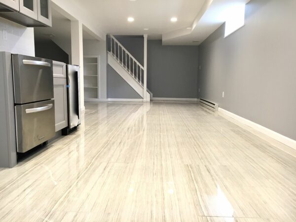 Basement Remodeling with Porcelain Tile Flooring, Kitchenette and Built In Storage in Clifton, Passaic County NJ