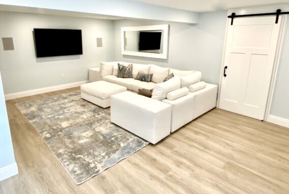 Basement Remodeling with Barn Door, Laminate Vinyl Plank Flooring in Sparta, North Jersey