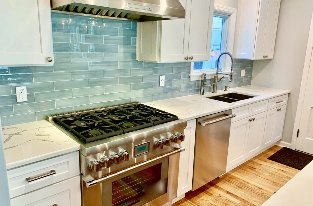 Kitchen Remodeling including Ripping Wall to Enlarge, Full Overlay Wood Cabinetry, Quarts Countertops, Glass Backsplash, Designer Appliances in Bergen County NJ