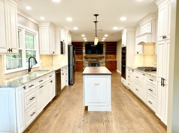 Brighton Cabinetry for Kitchen and Fireplace Wall, Oak Flooring, Walnut Wood Countertop in Rockaway, Morris County NJ