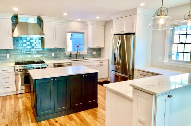 White Shaker Cabinets, Blue Glass Tile Backsplash, Island and 2 Tier Bar Height Counter, Wood Flooring and Stone Tops in Bergen County, NJ