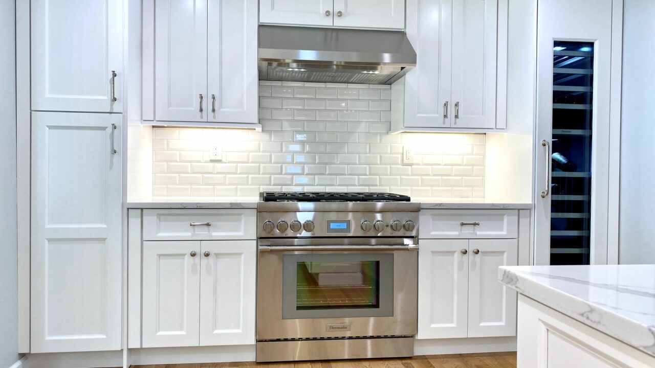 Kitchen with Shaker Cabinets, Thermador Appliances, Stone Countertops, Subway Tile Backsplash and Wood Floors in Cranford, Union County NJ