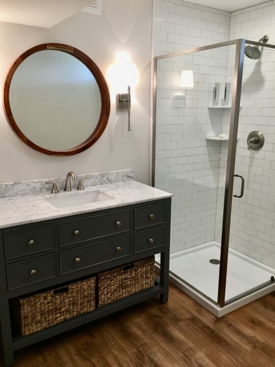 Basement Bath with Corner Shower, Porcelain Tile, Wood Vanity in Warren County NJ
