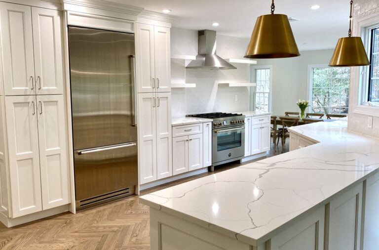 Open Concept Modern Kitchen with White Shaker Cabinetry, Open Shelving, Herringbone Oak Flooring, Calacatta Quartz Counters, Kohler Fixtures, Andersen Windows in Ramsey, Bergen County NJ