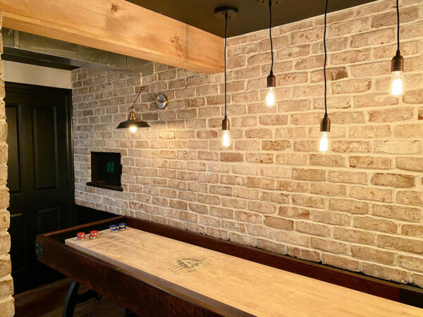 Basement with Brick Accents, Wood Beams Custom Lighting