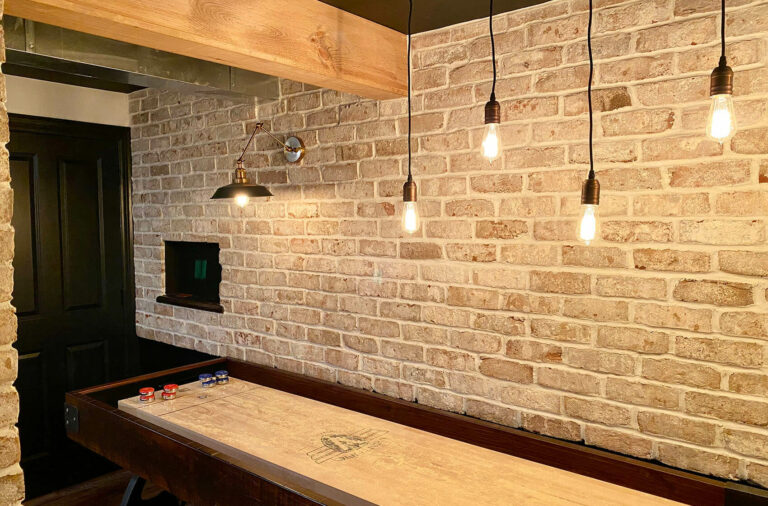 Basement with Brick Accents, Wood Beams Custom Lighting