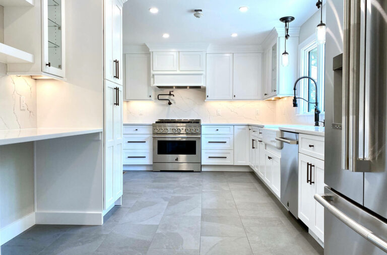 Kitchen with White Shaker Cabinets, Porcelain Floor, Andersen Windows