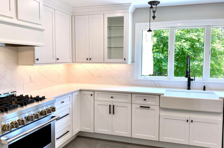 Kitchen Remodeling with Fabuwood Cabinetry, Quartz Tops and Full Quartz Backsplash, Under-Cabinet LED Lighting, and Kohler Farm Sink
