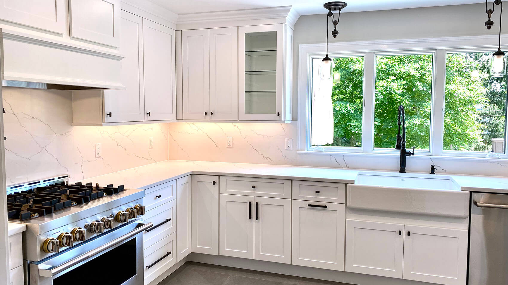 Kitchen Remodeling with Fabuwood Cabinetry, Quartz Tops and Full Quartz Backsplash, Under-Cabinet LED Lighting, and Kohler Farm Sink