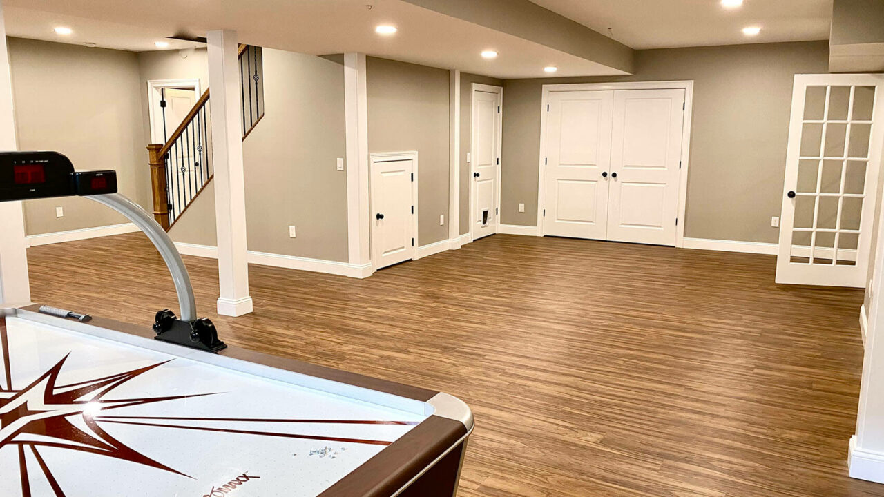 Basement Remodel with LVP Flooring, Ductless Heating _ Cooling, Oak Stairs and Metal Balusters