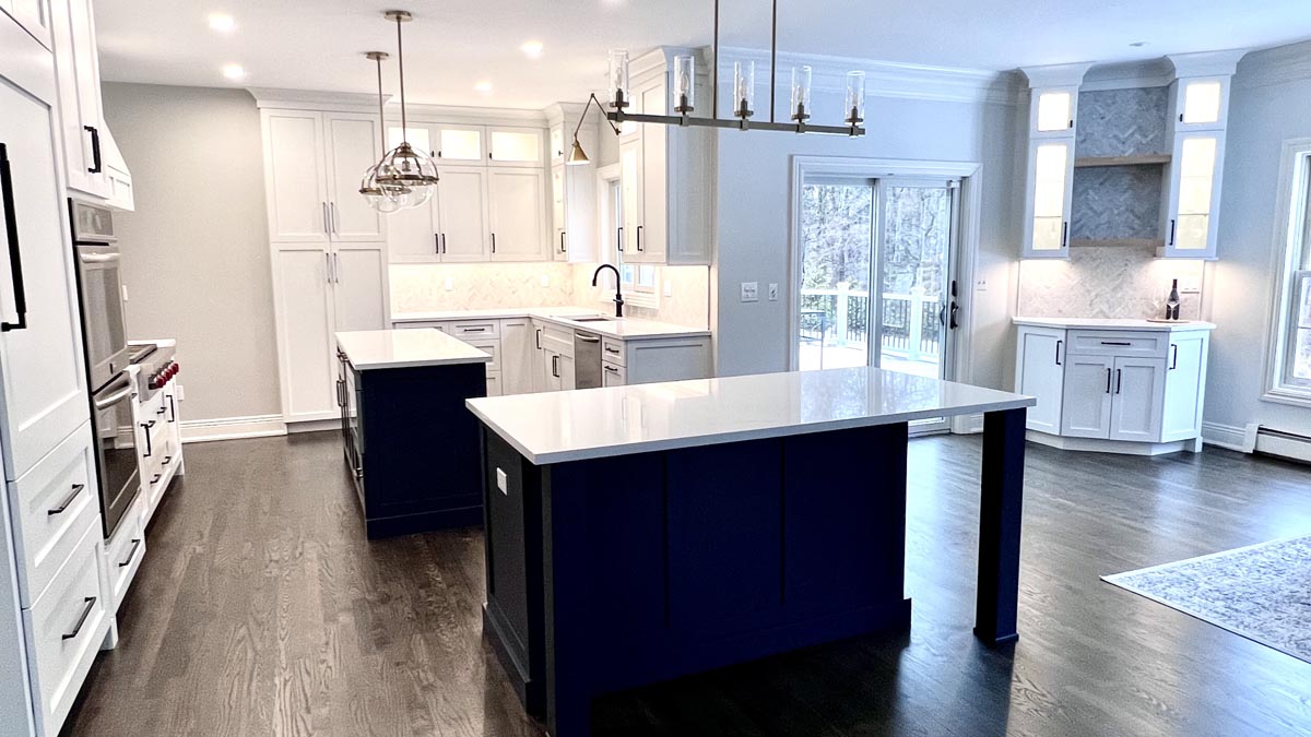 Sparta, NJ kitchen remodeling project with blue prep and seating island bar cabinetry.