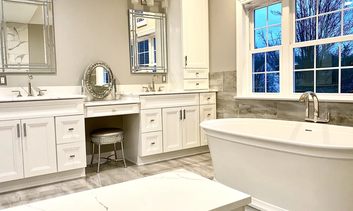 A NJ bathroom remodel featuring multiple vanity stations and sinks plus a free-standing tub.