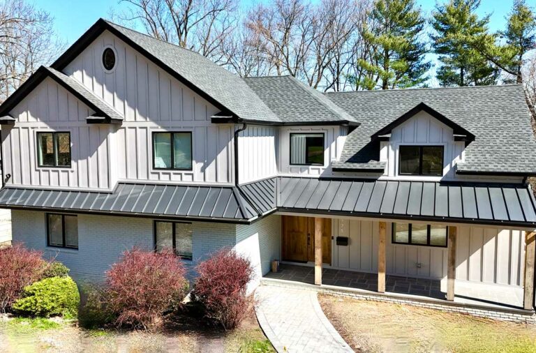front-view-of-white-brick-and-siding-with-black-a-line-roof-and-stone-path-walkway