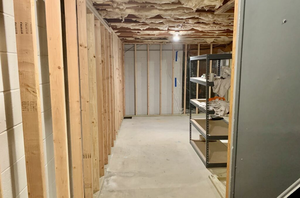 Basement Remodeling with Steel Beam Install ed to Remove a Column, Custom Trim and Paneling, Luxury Vinyl Plank Flooring, LED Lighting, Laundry _ Full Bath in Sparta, Sussex County NJ