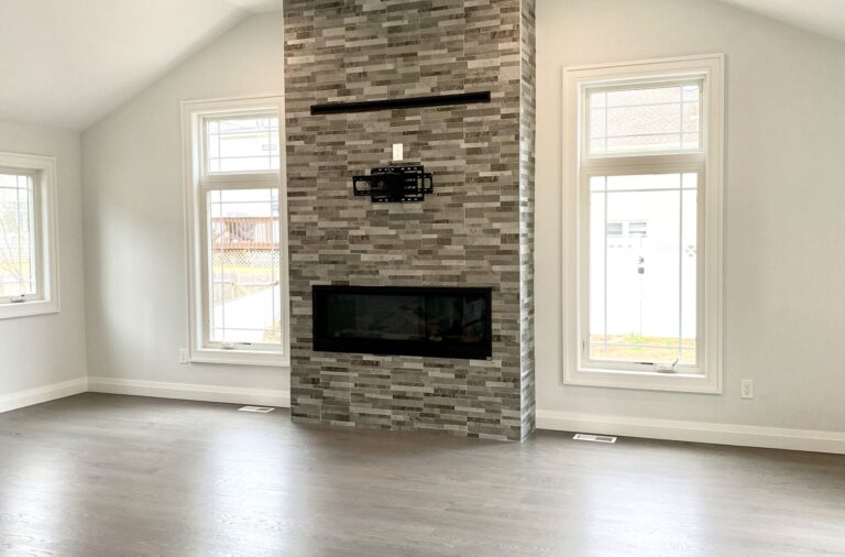 Family Room Addition with Vaulted Ceilings, Wood Flooring, Stone Fireplace, Andersen Windows and Patio Doors in Cranford, Union County NJ