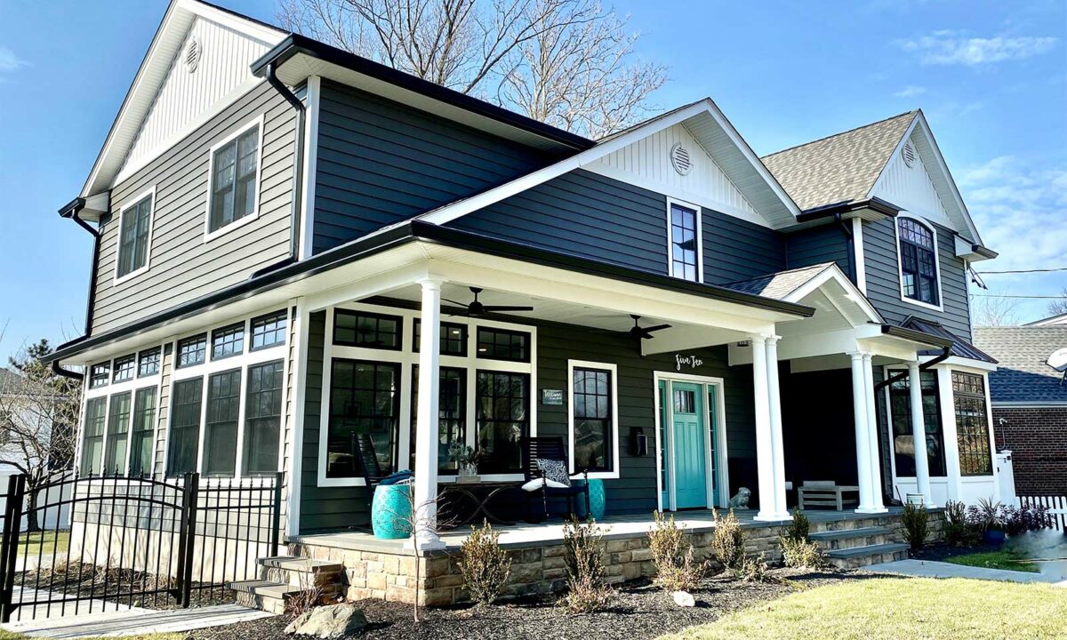 An upper level addition added to a blue house in NJ.