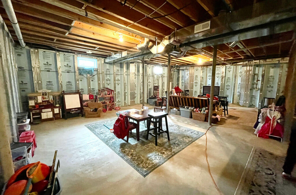 Unfinished basement with cement flooring