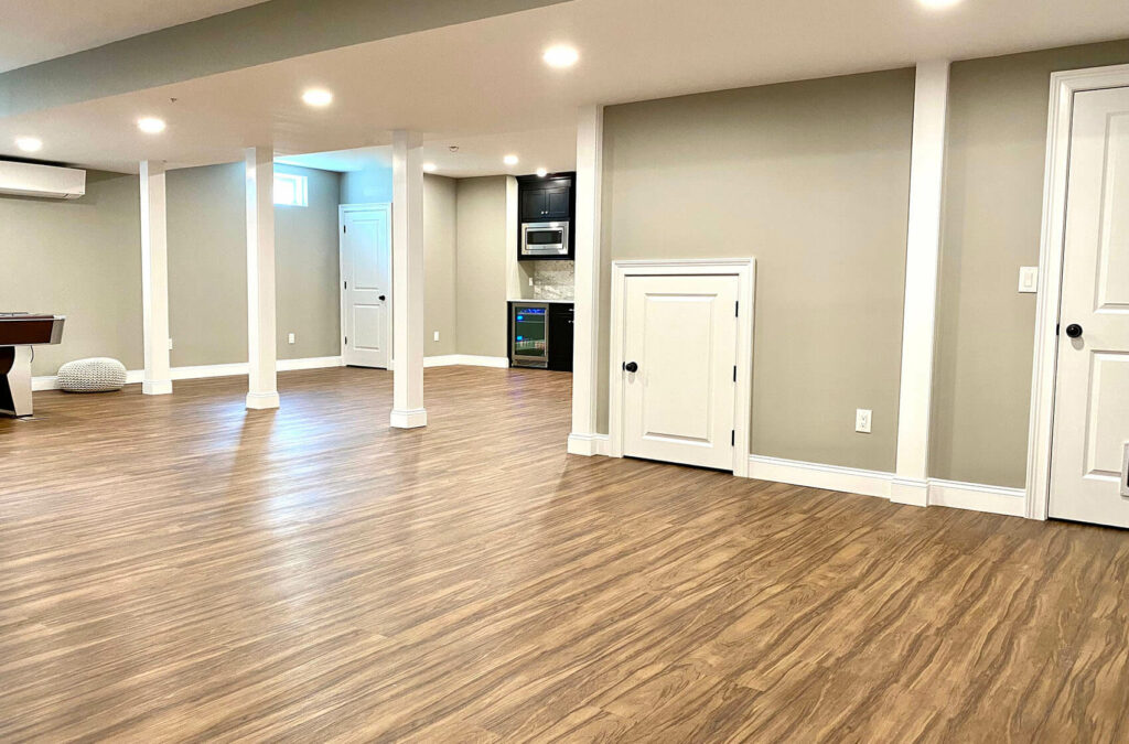 Remodeled basement with vinyl wood flooring