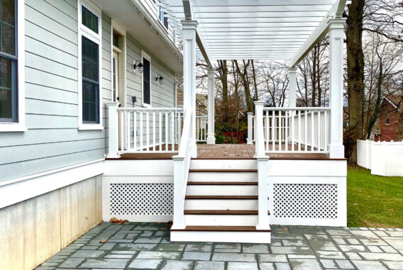 New wood composite deck with stone patio