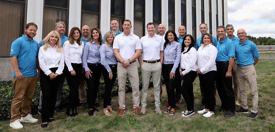 Group photo of the Magnolia Home Remodeling outside of their office in Union, NJ