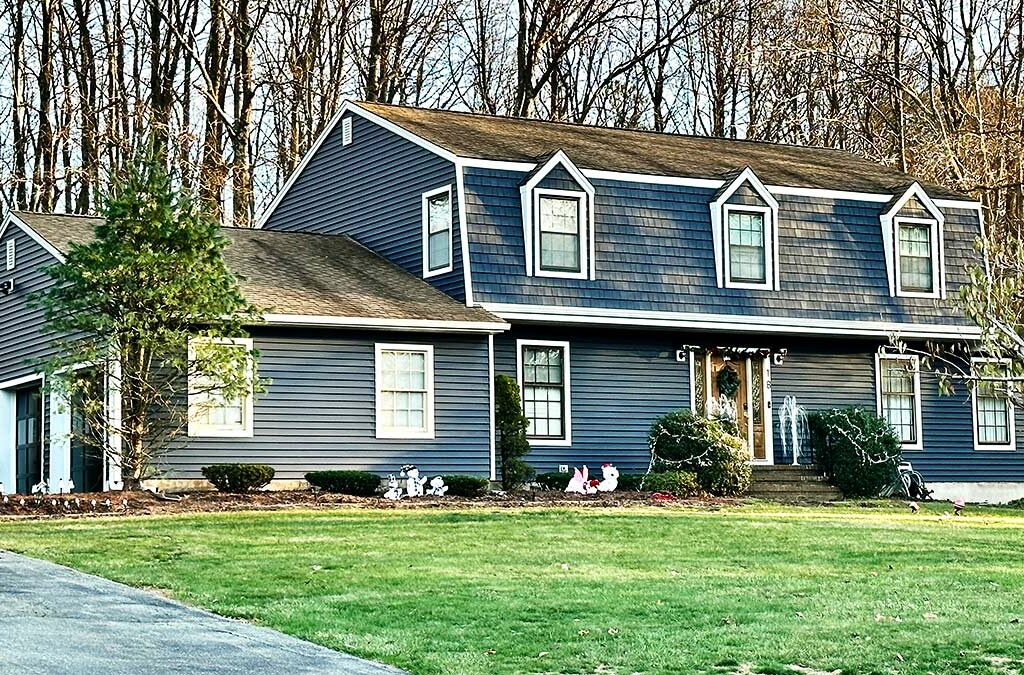 A home in Succasunna, NJ with new blue Alside siding.