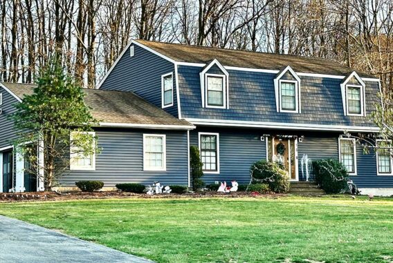A home in Succasunna, NJ with new blue Alside siding.