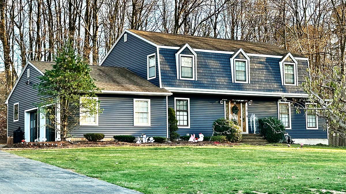A home in Succasunna, NJ with new blue Alside siding.