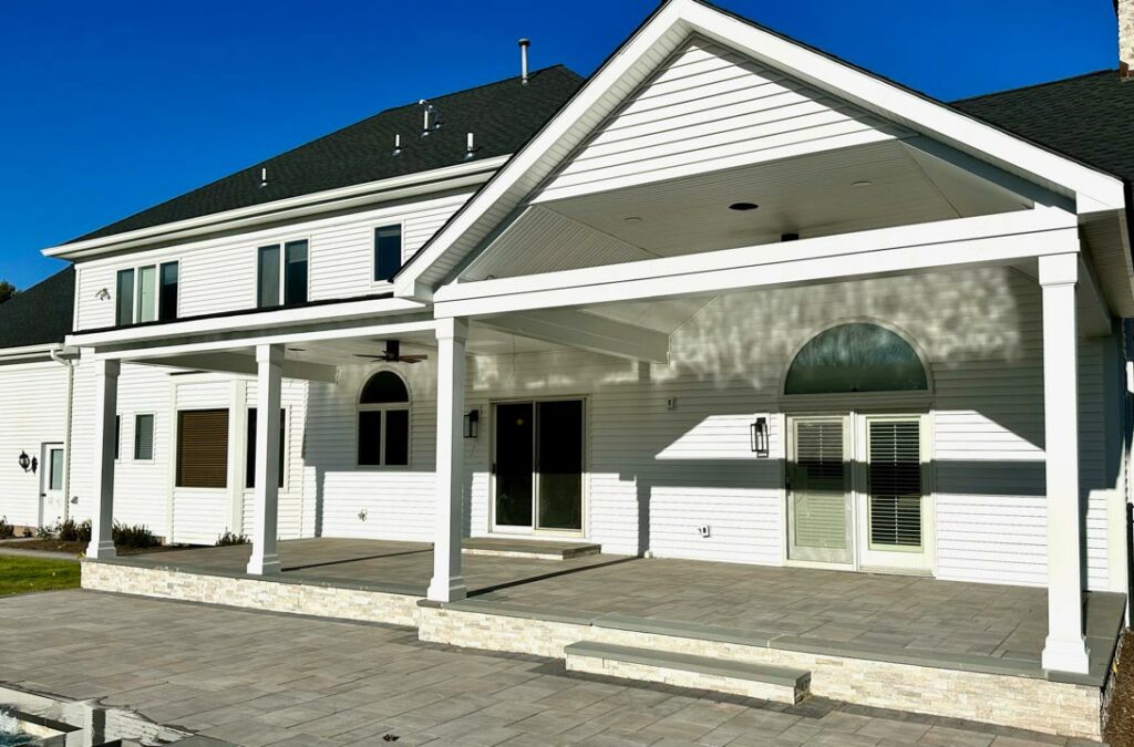 A shot featuring new porch vinyl installation on an open concept porch.