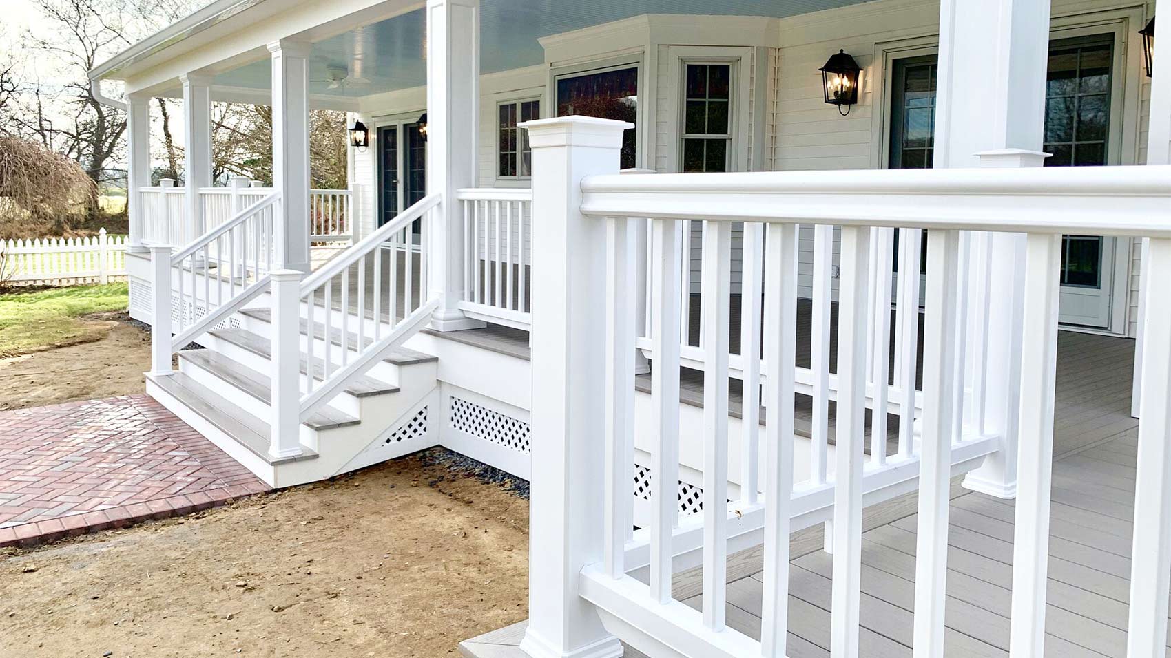 side-view-of-white-front-porch-with-brick-pathway