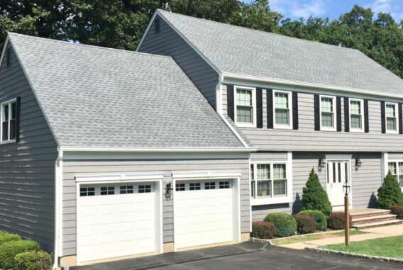 grey-colonial-home-near-green-lawn