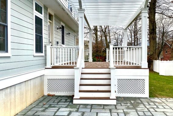 New wood composite deck with stone patio